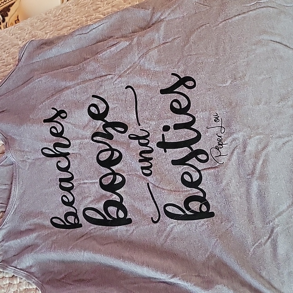 Three women's razor back tank tops
